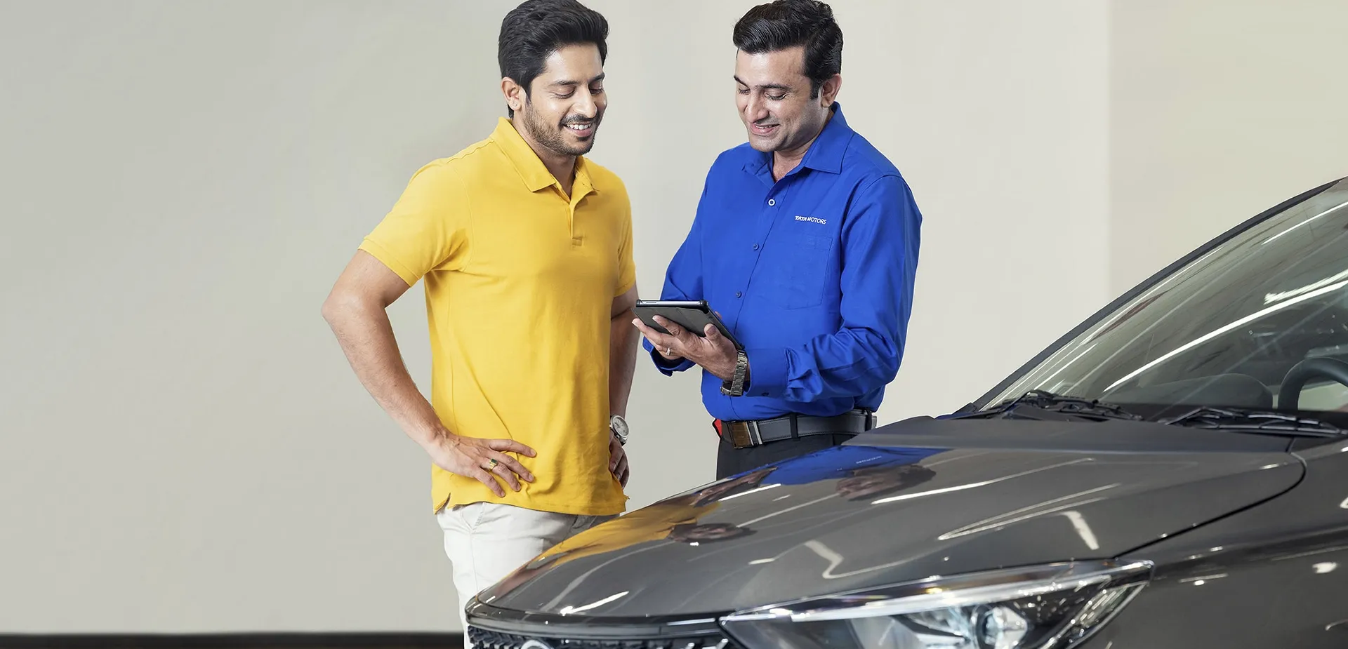 two men looking at vehicle diagnostics